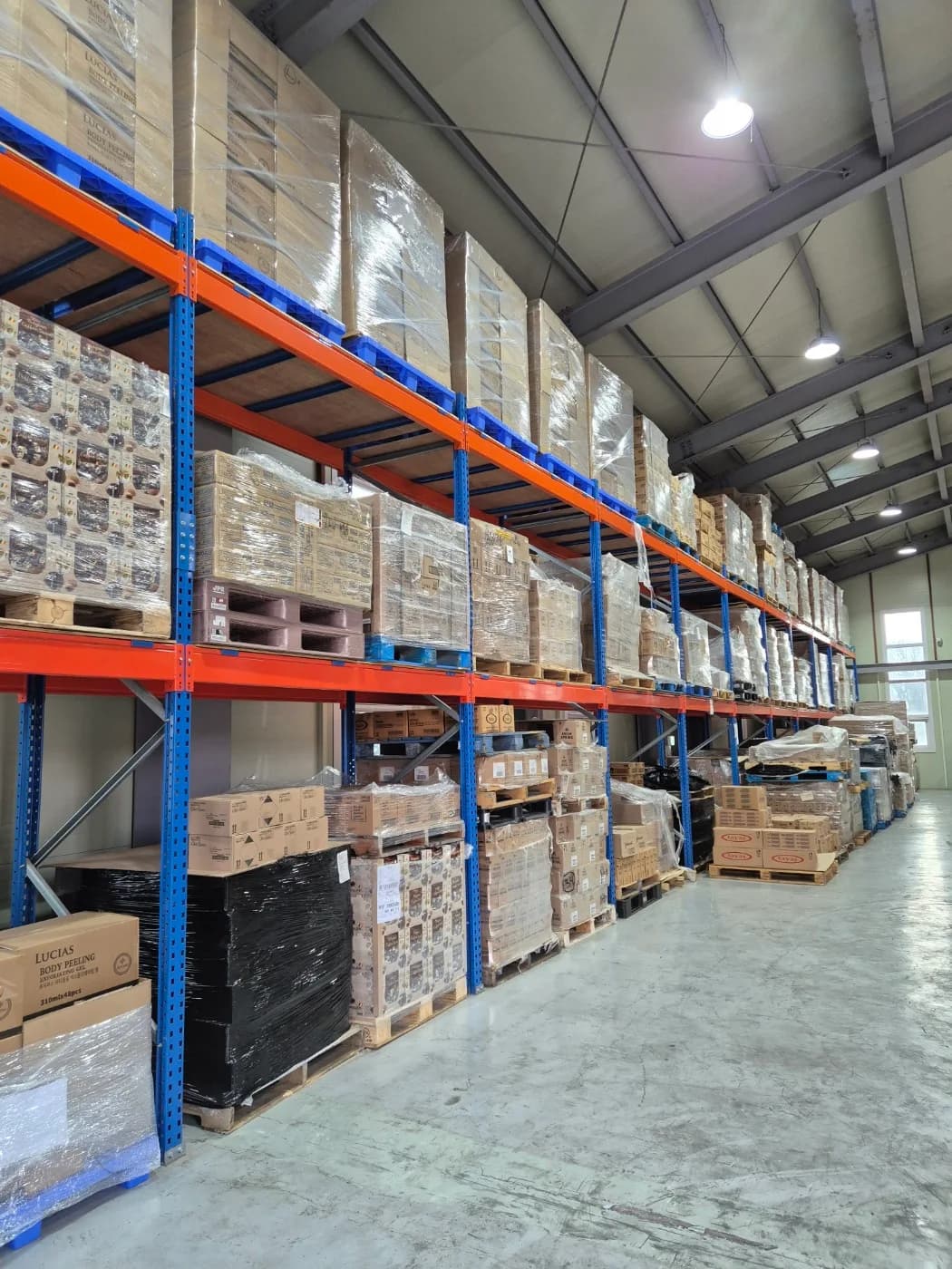 Palletized inventory stored on warehouse racks
