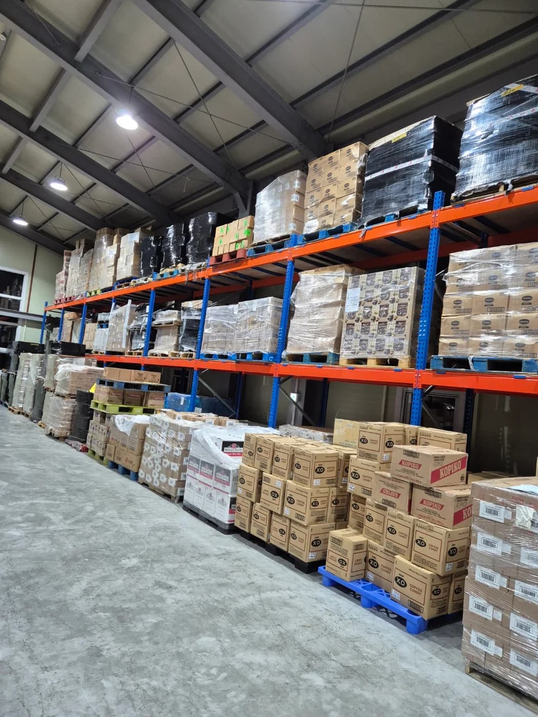 Palletized inventory stored on warehouse racks